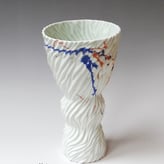 15-1-Flow-vase-small-275x15cm-porcelain-pigment-glaze-casted-blue-orange-TerraDelft